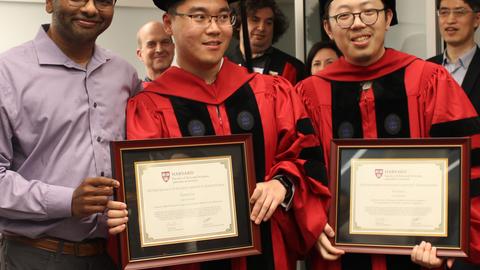 Tianle Liu and Yufan Li pose with their Dempster Awards with Professor Natesh Pillai at the 2025 Commencement Celebration