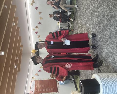 PhD Graduate Johann Gaebler receiving remarks from Mark Glickman
